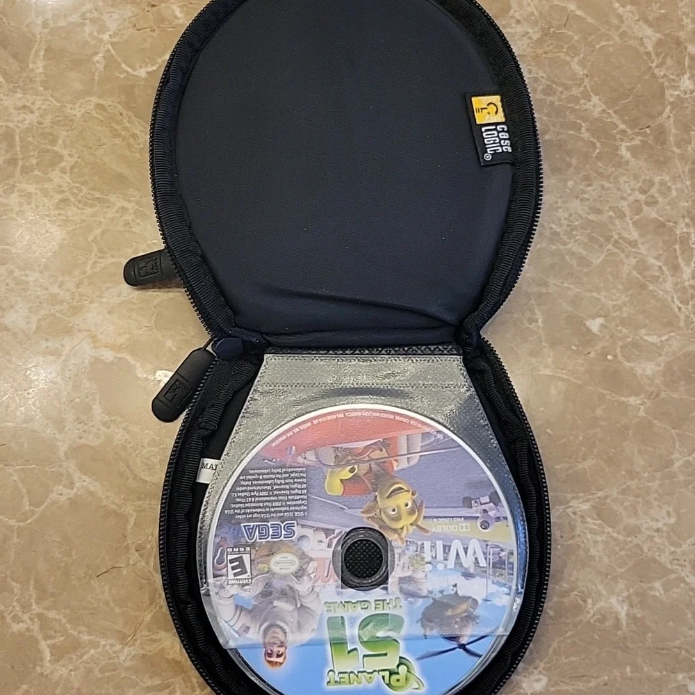 Wii Games/CDs Set of 3 w/ Case Logic Case